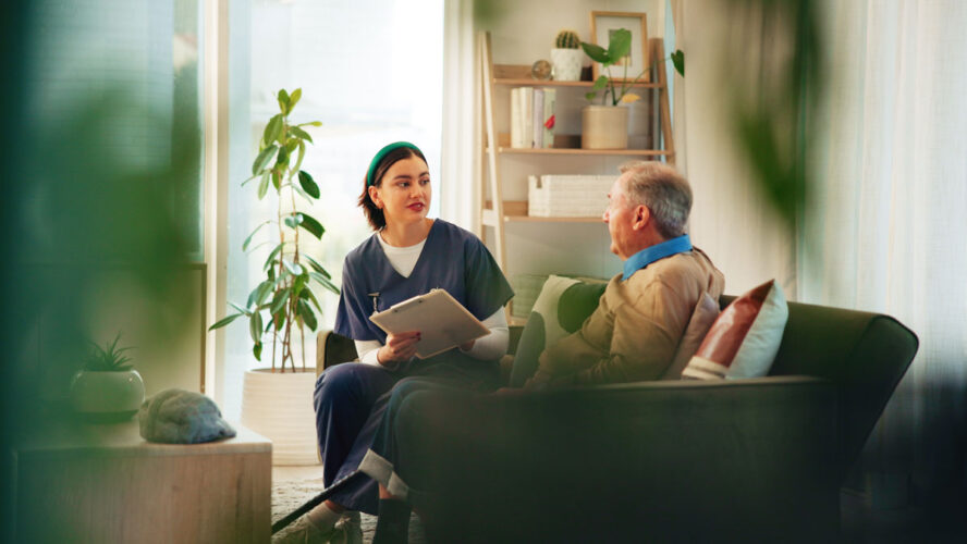 Caregiver, clipboard and senior man on sofa for assisted living, medical service and diagnosis in nursing home. Retirement, healthcare and nurse with elderly person for consulting, support and help