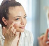 Close up of a young woman getting ready at home