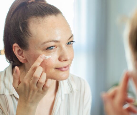 Close up of a young woman getting ready at home
