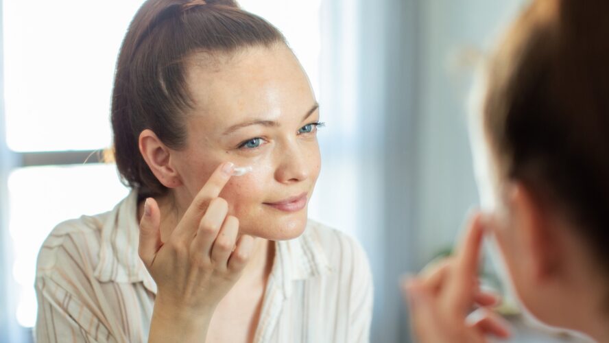 Close up of a young woman getting ready at home