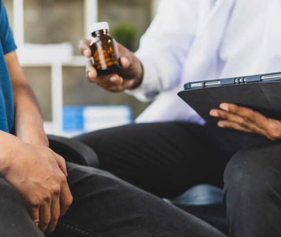 The doctor is diagnosing and giving advice on treating male erectile dysfunction. Concept of male health problems.