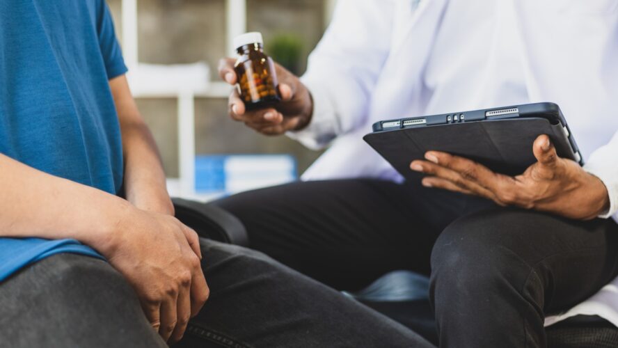 The doctor is diagnosing and giving advice on treating male erectile dysfunction. Concept of male health problems.