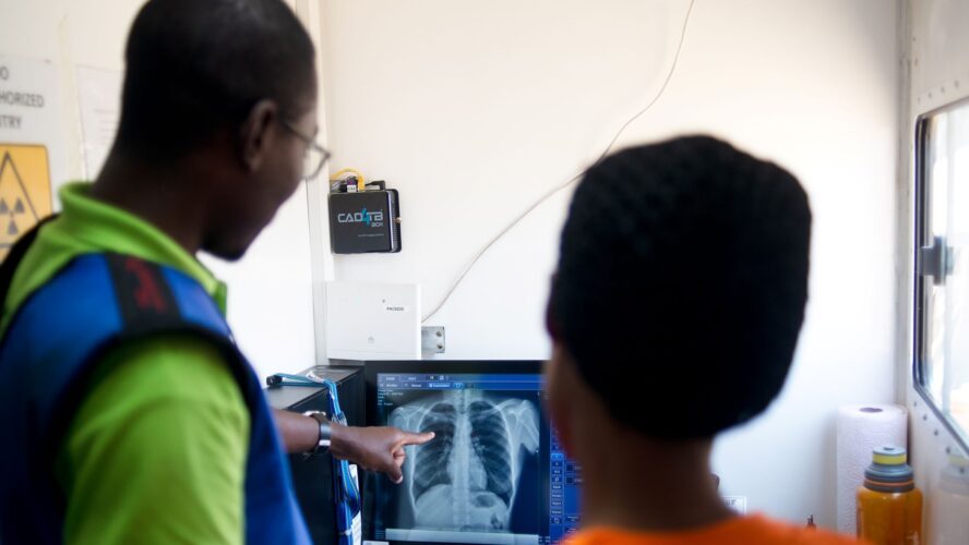 Healthcare professionals in Zambia reviewing chest x-rays during community screening project