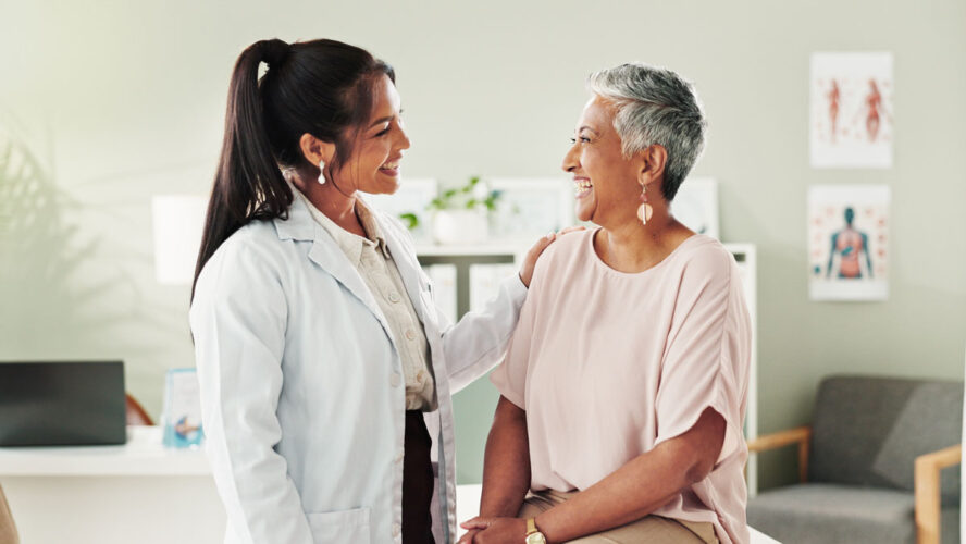 Clinic, doctor and check up with mature woman, discussion and healthcare, service and consultation. Hospital, caregiver and person with patient in office, test and support of medical professional