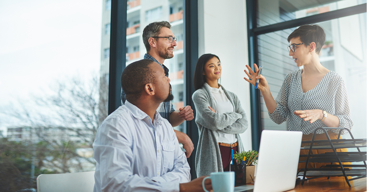 Cropped shot of a group of colleagues having a discussion in a modern office