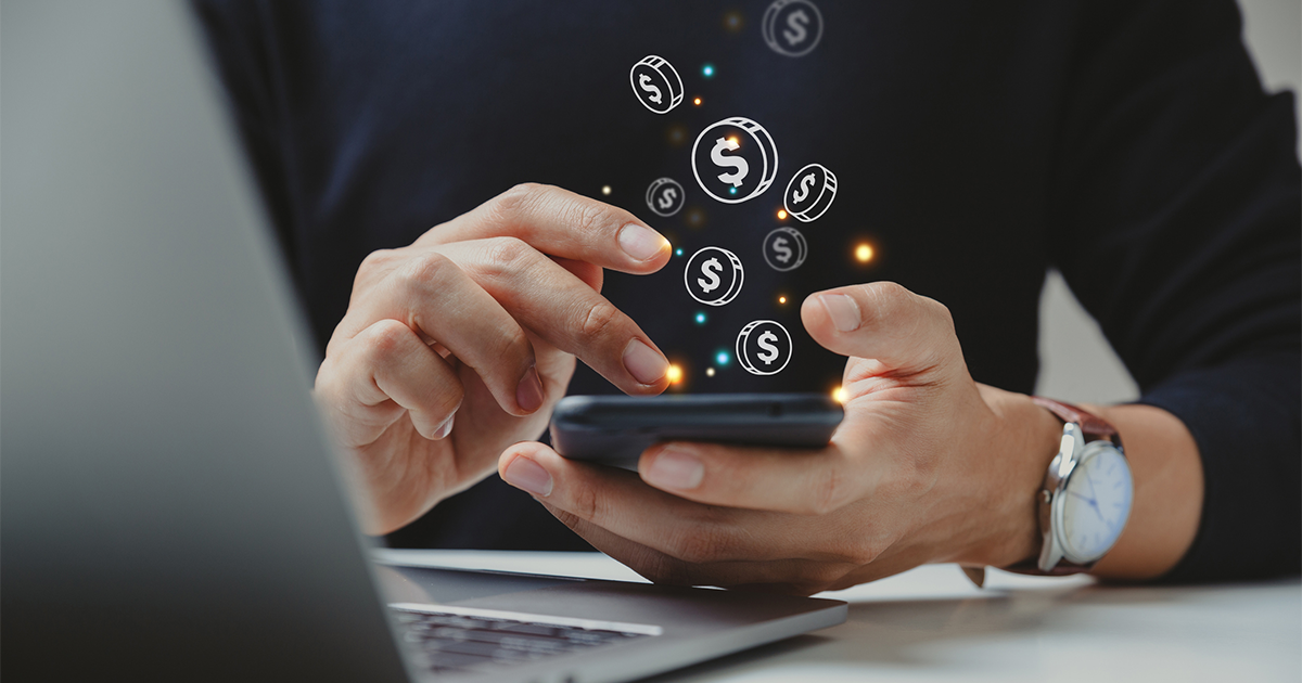 Hand of businessman using smart phone with coin icon, Online transaction, fintech business, Internet investment e-Commerce concept.