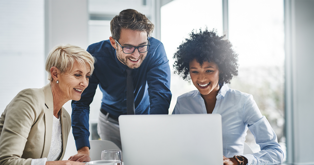 businesspeople working together on a laptop
