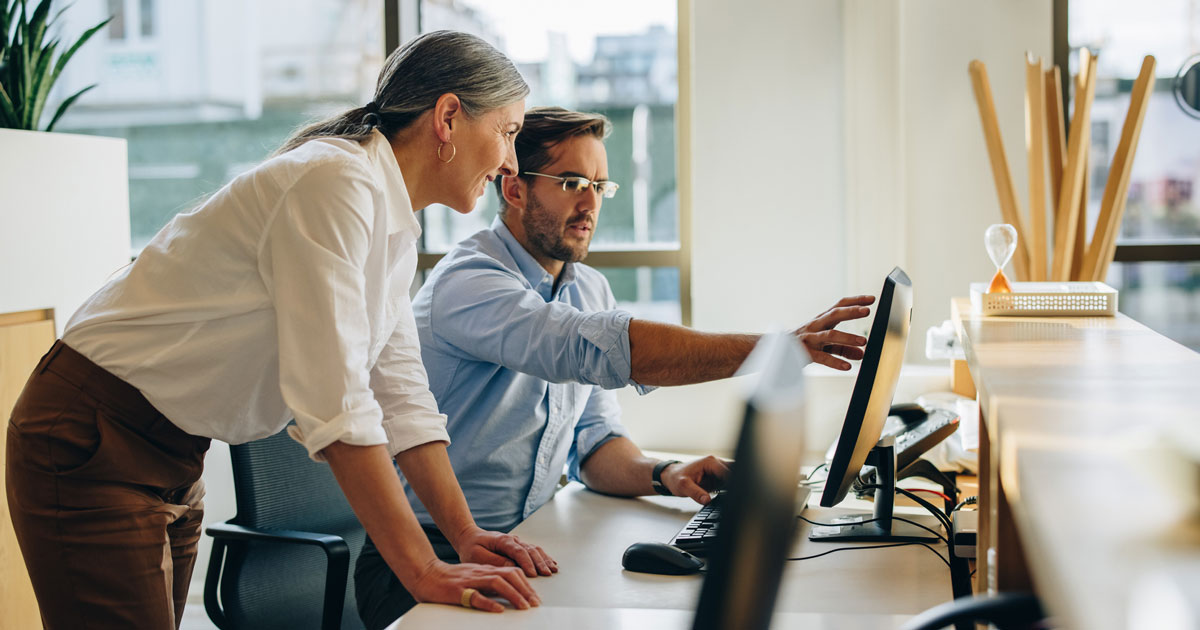 Two business people working together in office