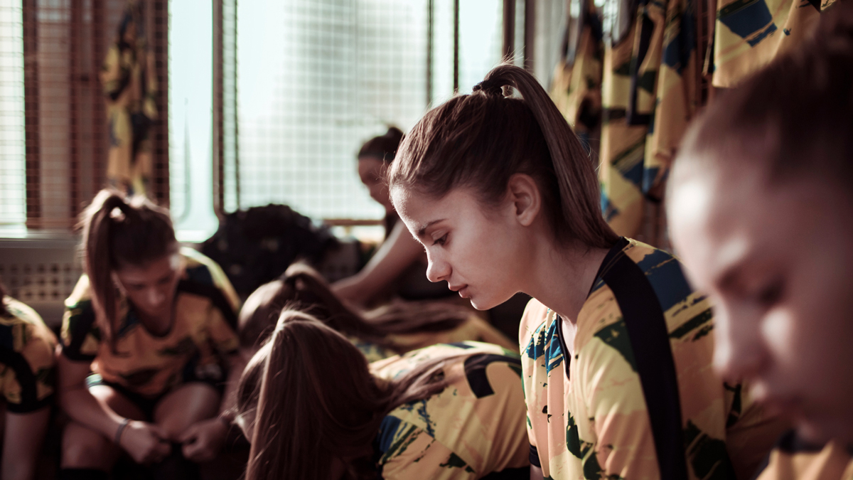 Close up of a female soccer club getting ready for a game
