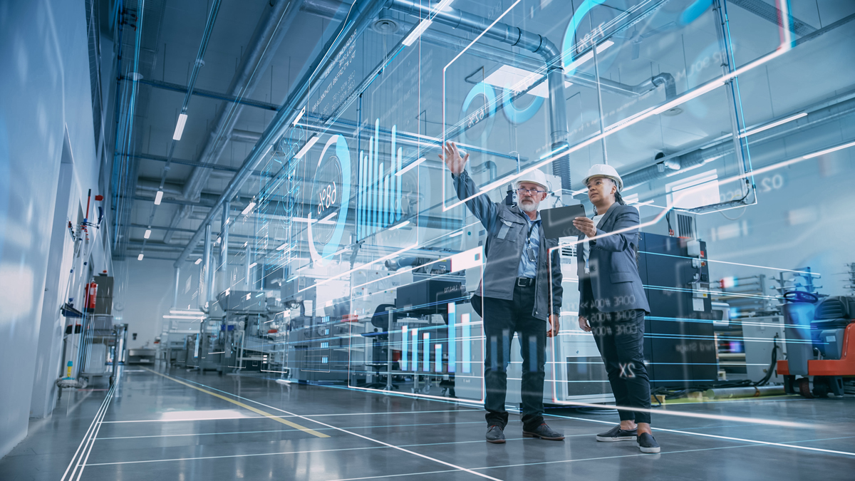 Factory Digitalization: Two Industrial Engineers Use Tablet Computer, Visualize the Wall of Big Data Statistics, Optimization of High-Tech Electronics Facility. Industry 4.0 Machinery Production - stock photo