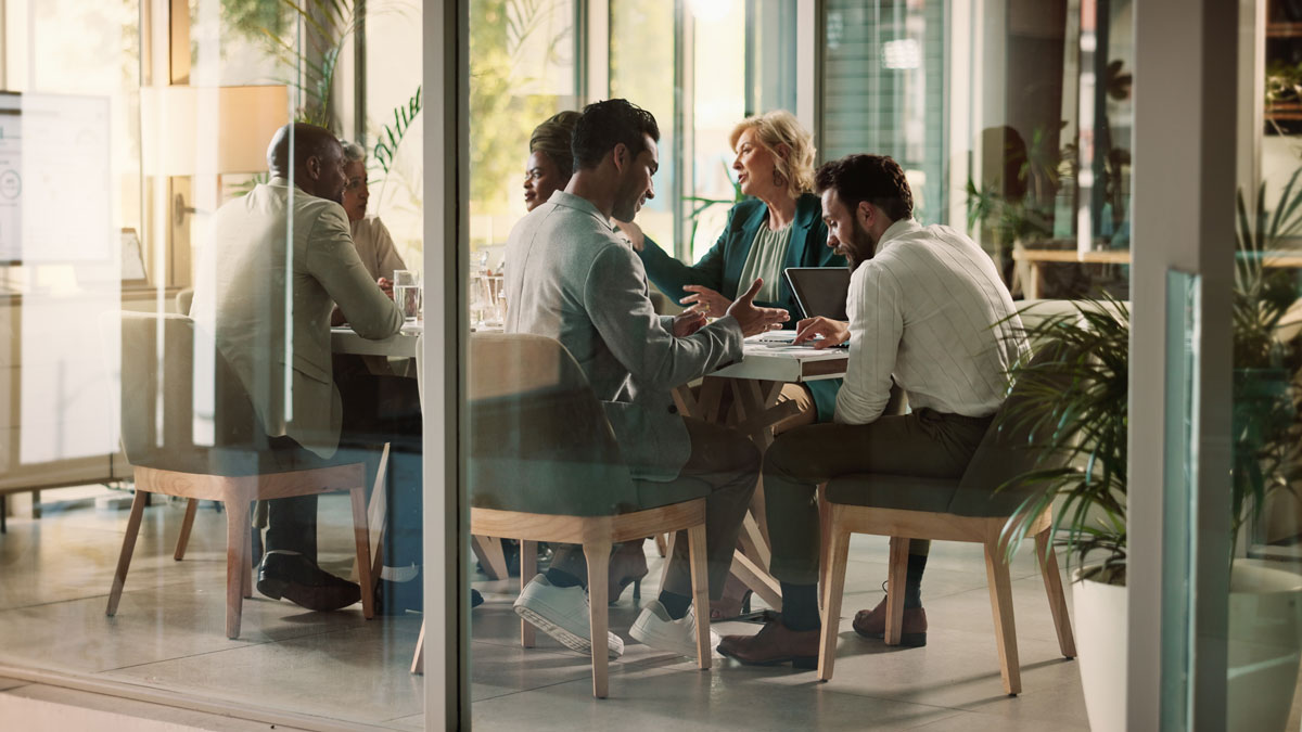 Corporate, people and talking at meeting in office for finance project, teamwork and accountant. Staff, communication and advice for proposal planning, information and feedback solution of investment