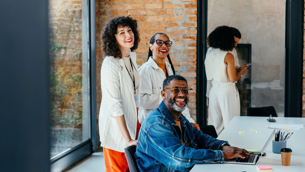 Joyful collaboration: A multiethnic corporate team in a modern office space
