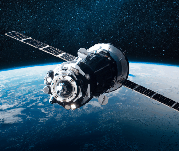 Cargo space ship on orbit of the Earth planet. Milky way on background. Elements of this image furnished by NASA