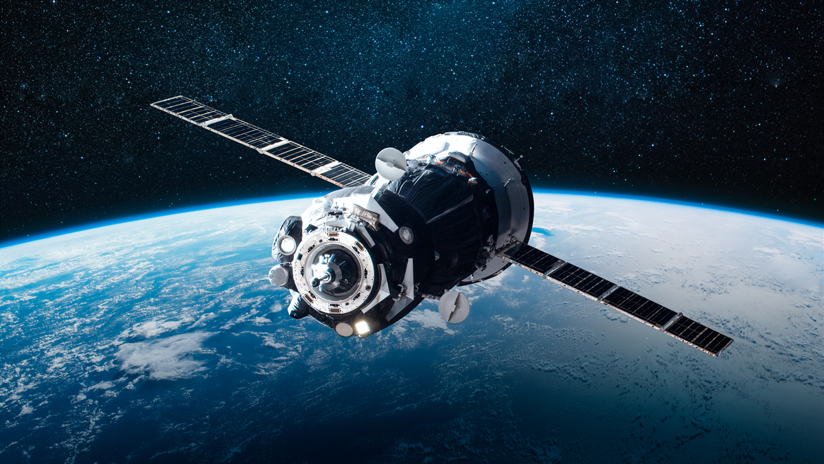 Cargo space ship on orbit of the Earth planet. Milky way on background. Elements of this image furnished by NASA