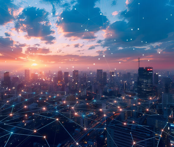 A bustling smart city skyline overlaid with glowing network connectivity lines during a picturesque sunset
