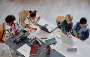 Top View of Children Studying Together at Table