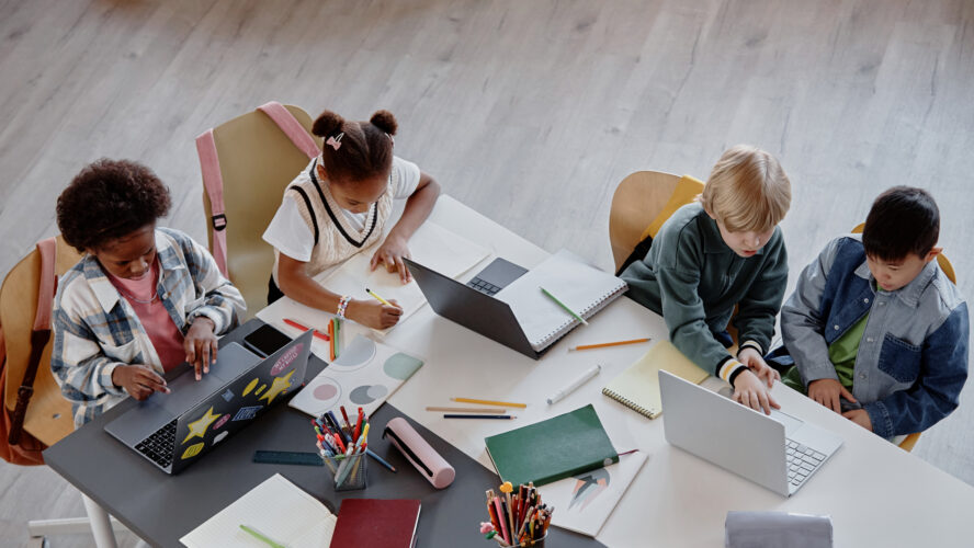 Top View of Children Studying Together at Table