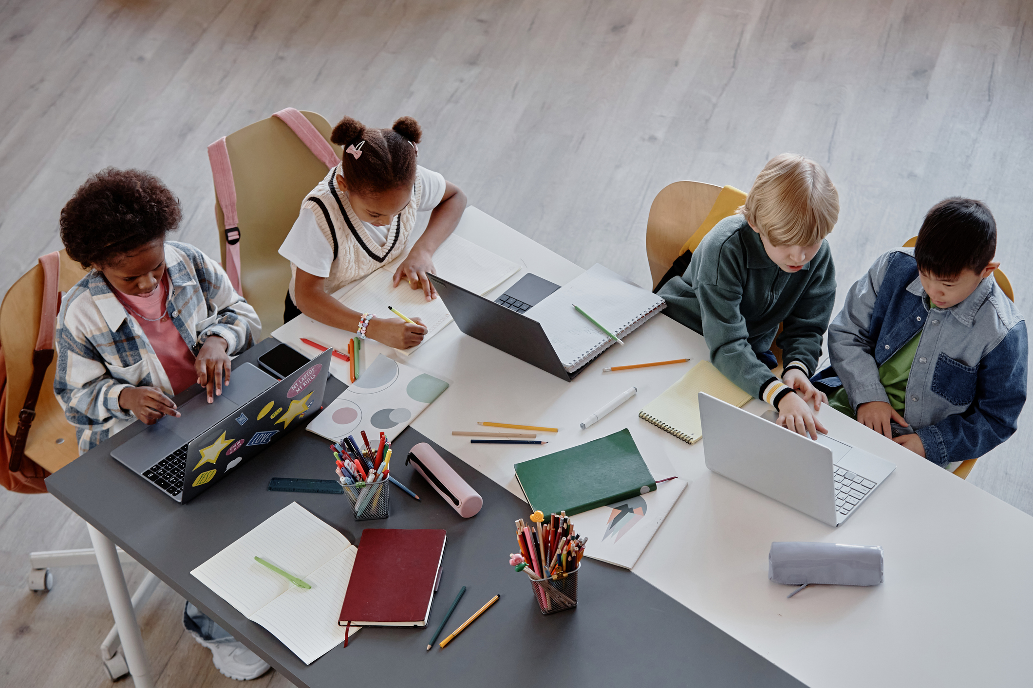 Top View of Children Studying Together at Table