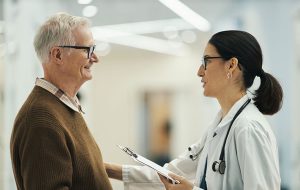 Male patient and female doctor talking