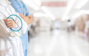 Surgeon and anesthetist doctor ER surgical team with medical clinic room background for emergency nursing care professional teamwork and patient trust in ICU hospital's hospitality concept