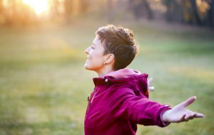 Young beautiful woman feeling good in nature. About 20 years old, Caucasian brunette.