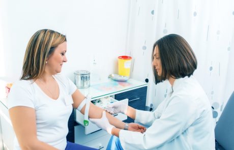 Nurse getting blood from on a female donor