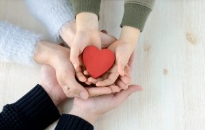Heart in famiy hands