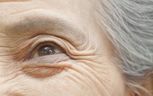 Close up of older Chinese woman’s eye