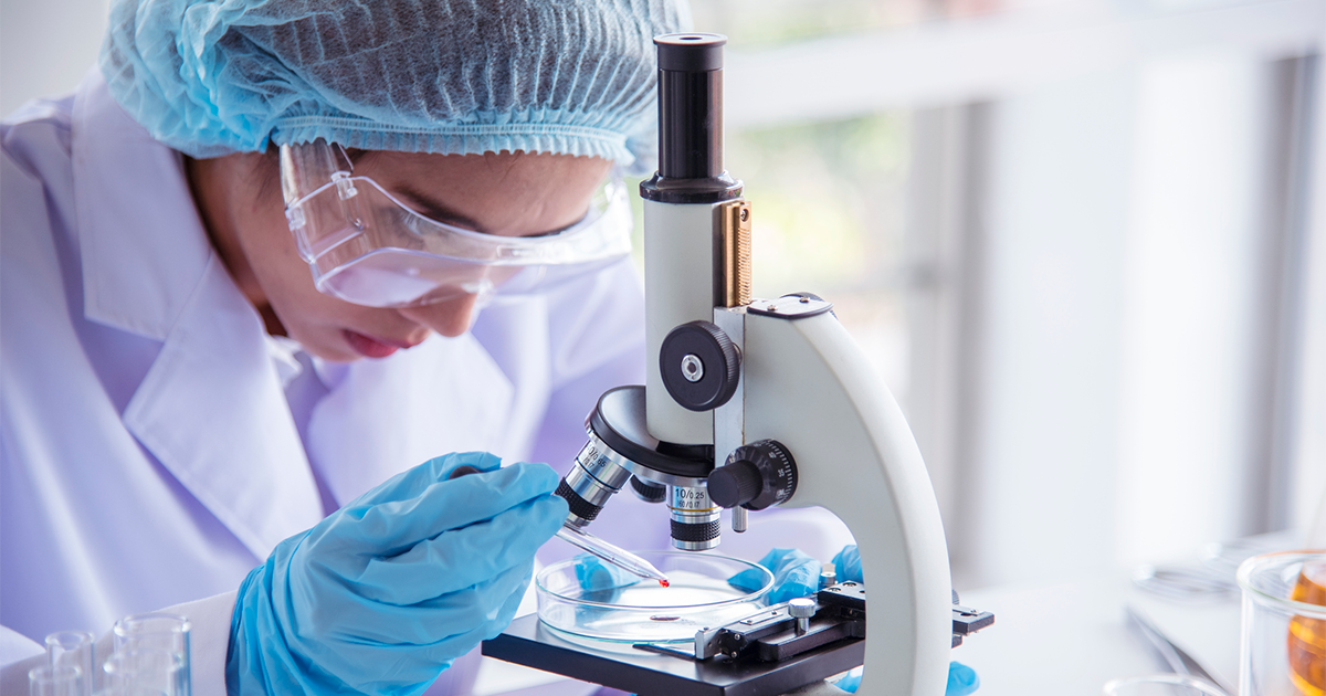 Woman scientist in lab look at science microscope medical test and research biology chemistry