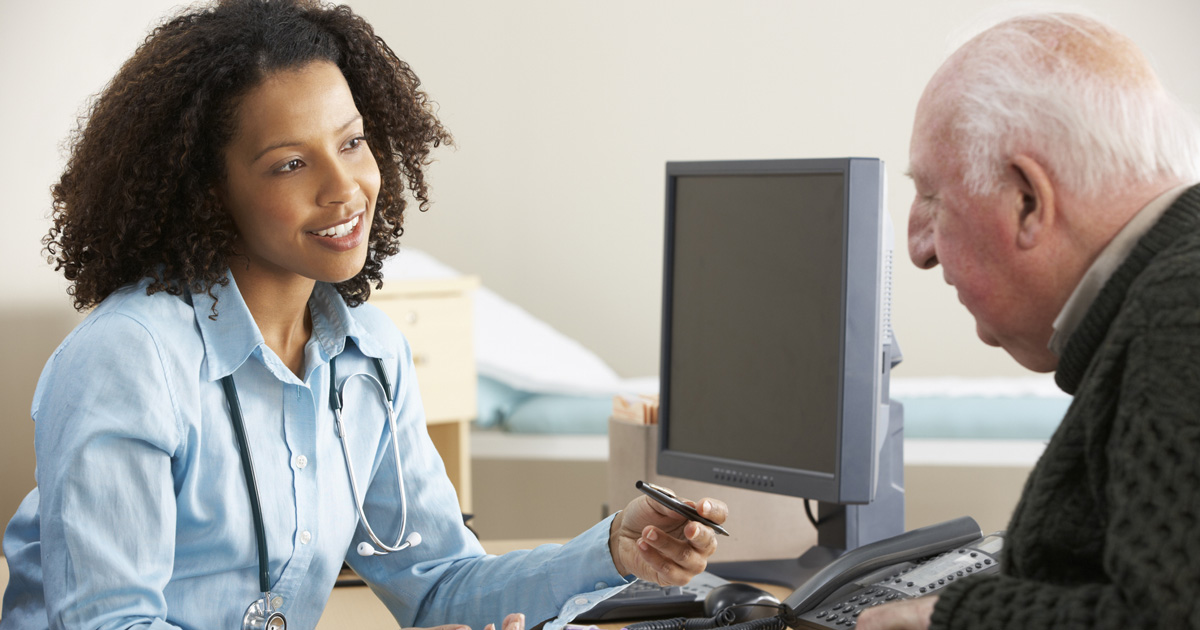 Young female Doctor with senior male patient
