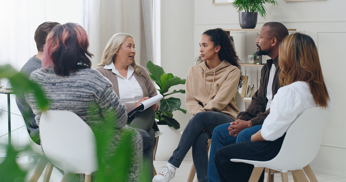 Diversity, mental health and group therapy counseling support meeting, healthy conversation and wellness.