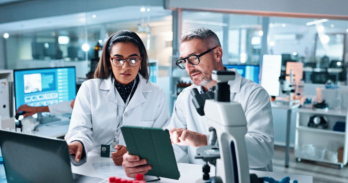 Collaboration, tablet or science with people in lab together for research or development. Innovation, tech and microscope with scientist team in clinical trial for planning or medical investigation