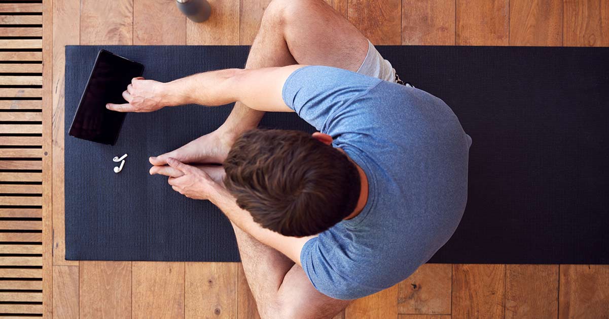 Men sitting on yogamat