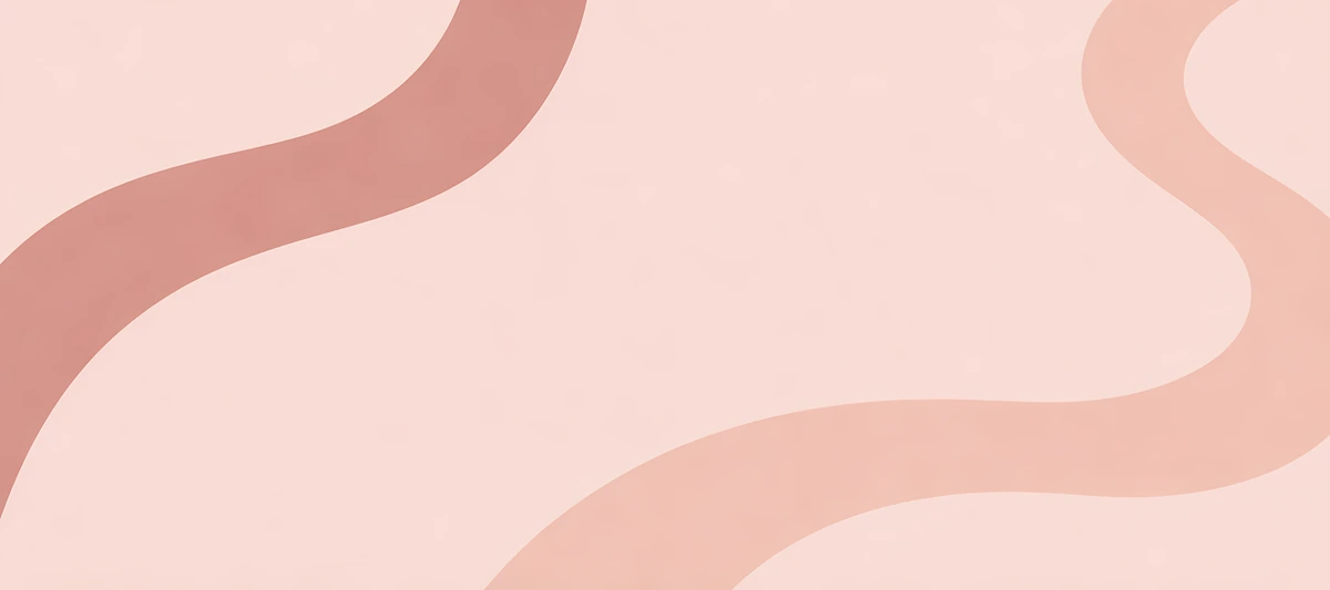 Broad rose and peach-pink ribbons curve around an open pale blush center., 90x40cm desk mat preview