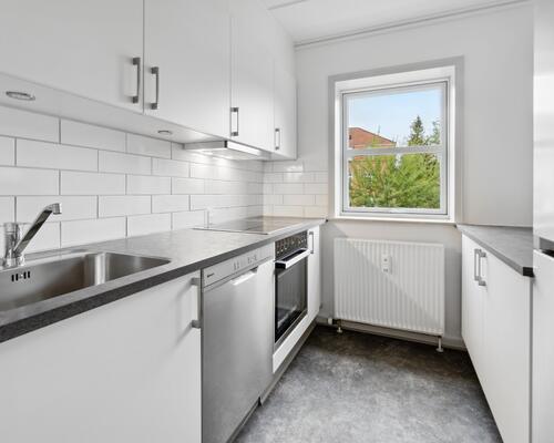 Bo i hjertet af Vejle med kig til åen