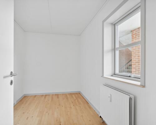 Bo i hjertet af Vejle med kig til åen