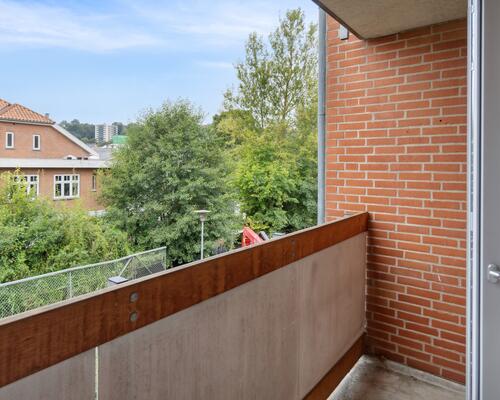 Bo i hjertet af Vejle med kig til åen