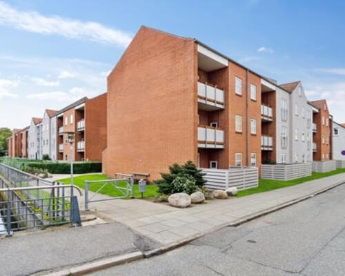 Bo i hjertet af Vejle med kig til åen