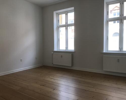 Centralt beliggende lejlighed i flot ældre ejendom