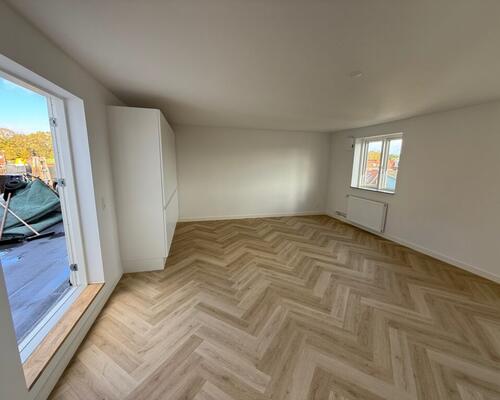 Nyrenoveret penthouselejlighed med tagterrasse i centrum af Fredericia