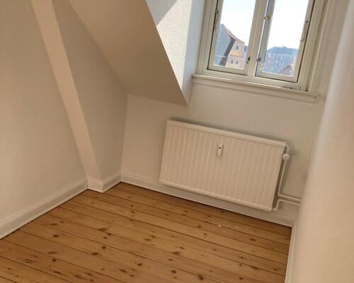 Centralt beliggende med fælles have...