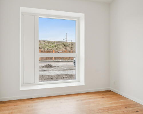 Nydelig 2-værelses lejlighed med rummelig planløsning, moderne køkken og terrasse ud til gården!