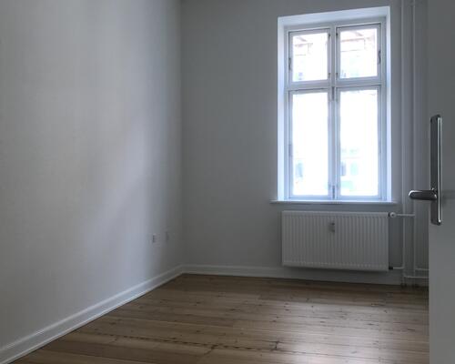 Centralt beliggende lejlighed i flot ældre ejendom