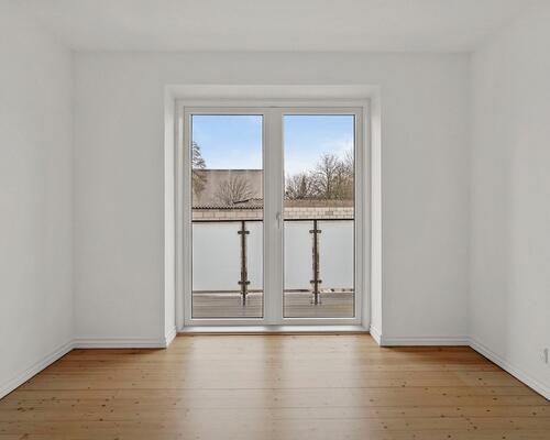 Lys og velindrettet 3-værelses lejlighed med altan