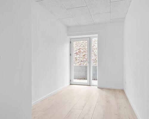 Lækker, nyrenoveret lejlighed med terrasse