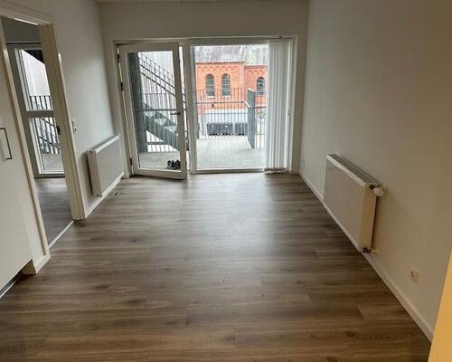 Flot lys lejlighed tæt på letbane og Odense Banegård