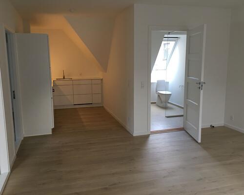 Lækker, delevenlig taglejlighed midt i Horsens – perfekt til dig, der vil bo centralt.