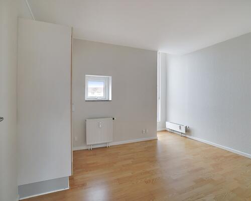 Vil du bo i en attraktiv ejendom helt centralt?