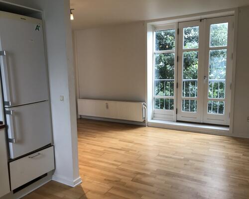 Flot lejlighed centralt i Kolding med fælles have og mulighed for vaskesøjle