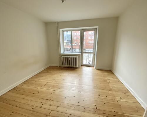 Indbydende 2-værelses lejlighed i centrum af Odense